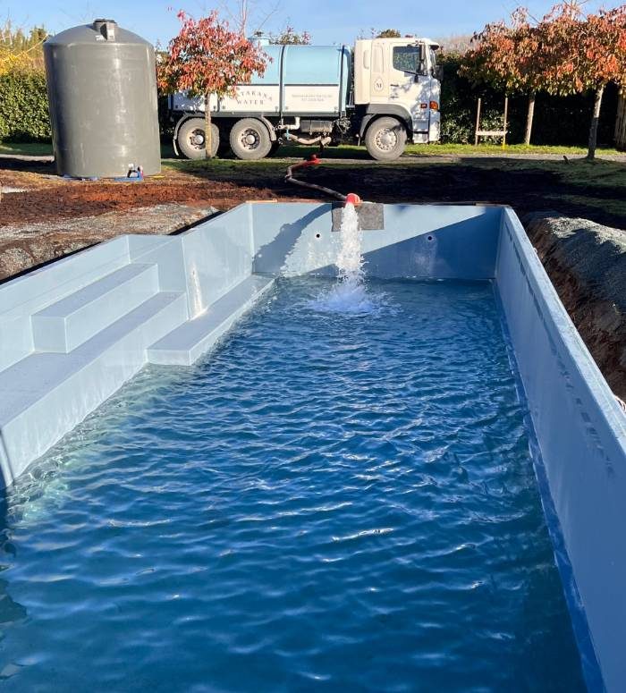 Truck filling a pool